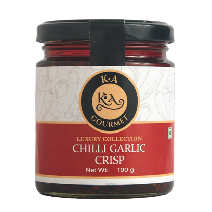 A jar of KA Gourmet Chilli Garlic Crisp in a clear glass jar with a black lid, labeled with the brand's logo and product details.